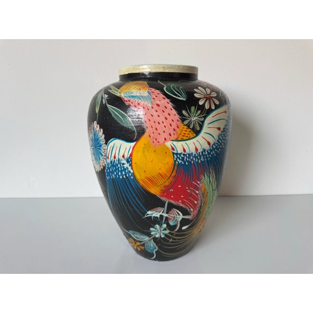 Vibrant and full of character, this 1980’s vintage terracotta vase captures the joyful spirit of tropical folk art. Hand-...