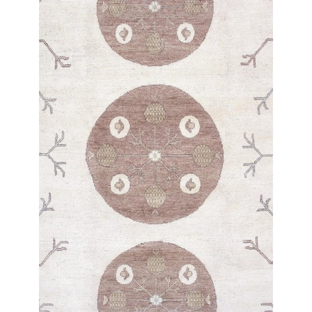 Khotan hand-knotted rugs are quite unique folk artifacts which display elements of rich, historical cultures. These rugs...