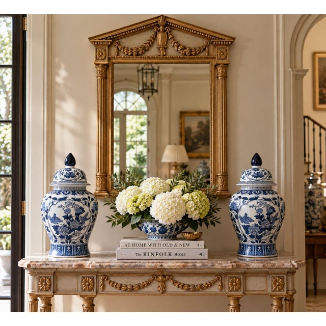 A classic pair of blue and white ginger jars, decorated throughout with delicate bird and flowering branch motifs. The...
