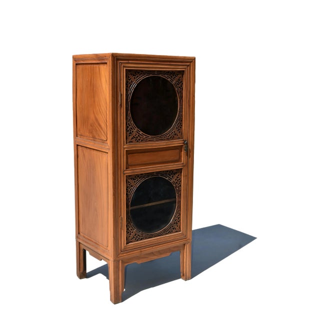 A beautiful 20th century solid wood custom linen press with glass door. The cabinet is constructed with three frame...