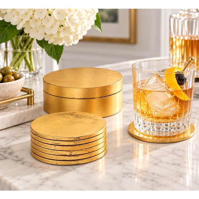 vintage set of six gilt / gold-leaf beverage coasters with a matching round lidded storage holder, for a total of seven...