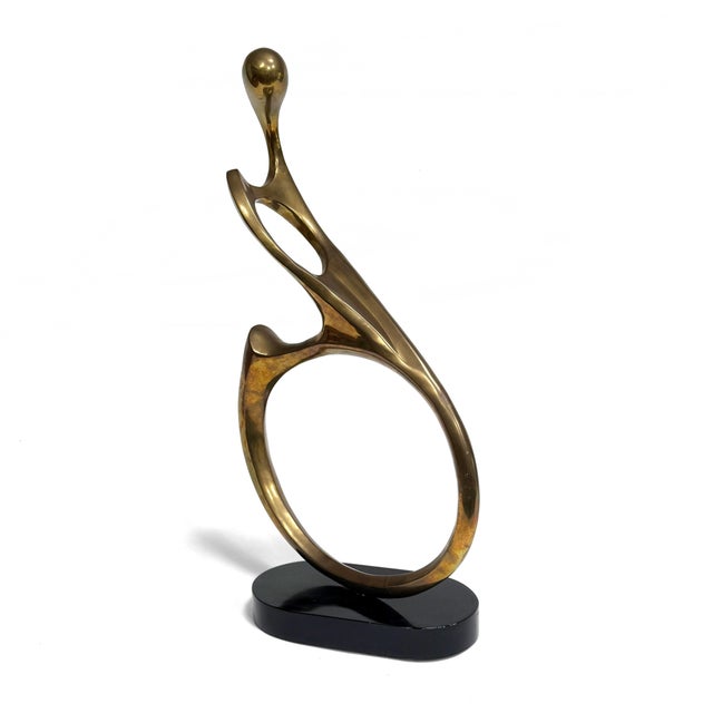 This elegant, undulating biomorphic bronze sculpture combines flowing lines with compelling shapes. It is mounted on a...