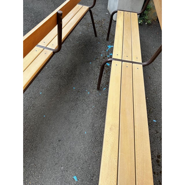 Pair of stackable school benches in light wood and brown metal. Good overall condition, paint chipped on the legs.