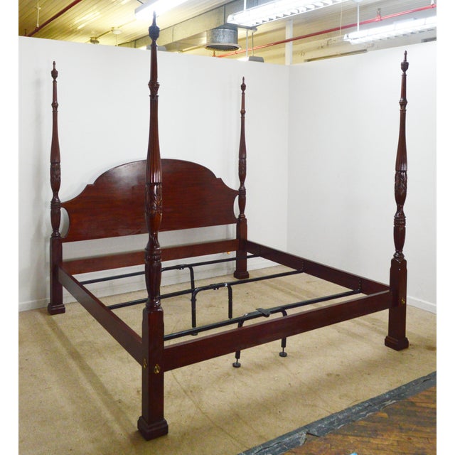 King Bed by Henkel Harris. Store item #540. It features carved wood and comes with slats.