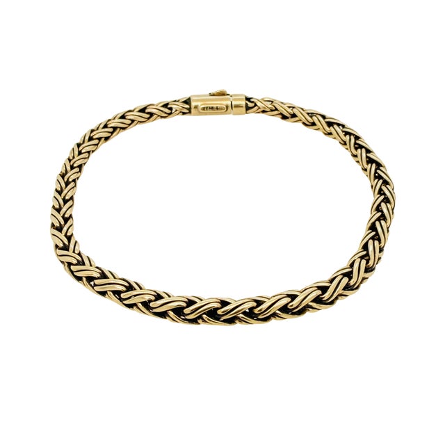 A woven wheat-link chain in warm 14K yellow gold, this Tiffany & Co. bracelet dates to circa the 1950s-1960s. The tightly...