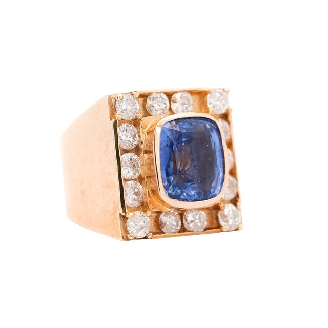 GIA-certified 8.56 carat cushion cut natural blue sapphire of Sri Lanka origin with no heat treatment, bezel-set within a...