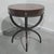A very good circular mahogany centre table with cradle base, brass lion mask detailing and wonderul original dark red...