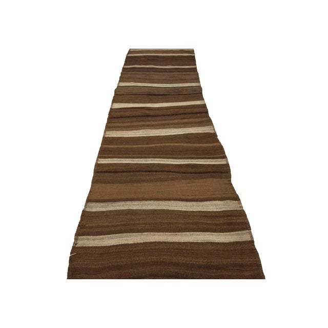 Handwoven vintage natural kilim runnner from Kars region of Turkey. Approximately 50-60 years old. In very good condition