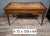 A louis xvi style mahogany flat desk, beautifully understated, with three drawers in the frieze, each adorned with brass...