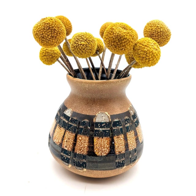 Offered is a vintage Mid 20th Century Lapid Pottery Works glazed stoneware bud vase made in Israel. Done in textured earth...