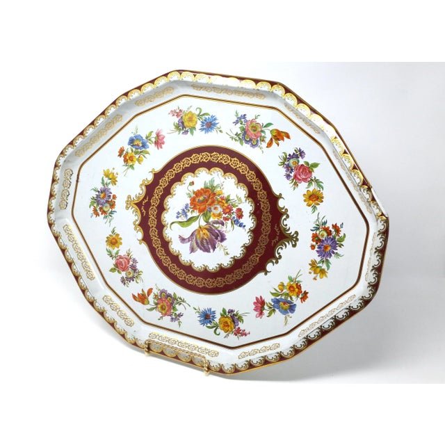 A vintage, octagonal tin tray by Daher, with a colorful printed flower pattern on white background with gold accents. Good...