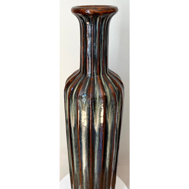 Monumental Mid-Century Modern Ribbed Ceramic Floor Vase with Drip Glaze, West Germany Style A striking monumental ceramic...