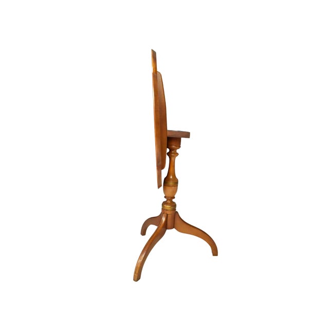 This vintage L. Hitchcock tilt-top tea table is a beautiful example of the Early American aesthetic and the celebrated...