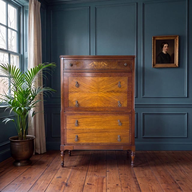Late 19th century American tall chest of drawers executed in the Federal and Sheraton tradition. Constructed in dark-...