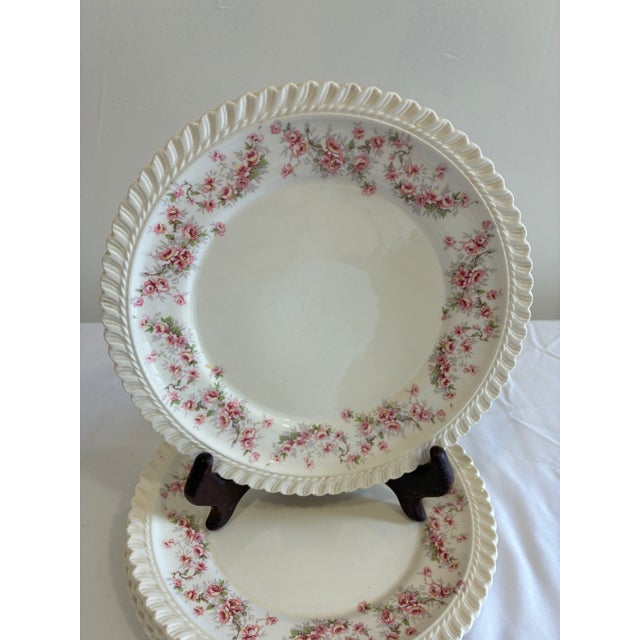 Set of four vintage Harker plates in the Royal Gadroon “Bridal Rose” pattern, featuring soft pink floral sprays and a...
