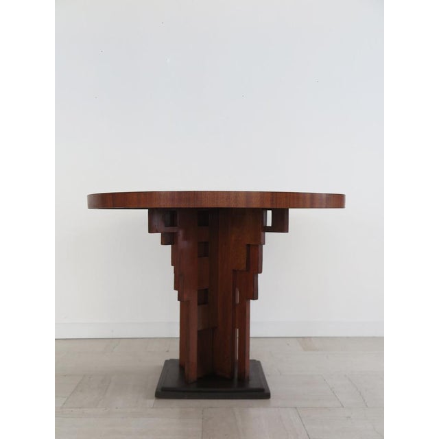 Table or Gueridon with circular top in burl wood and sculptural foot in solid dark wood, made in Italy in the 1930s
