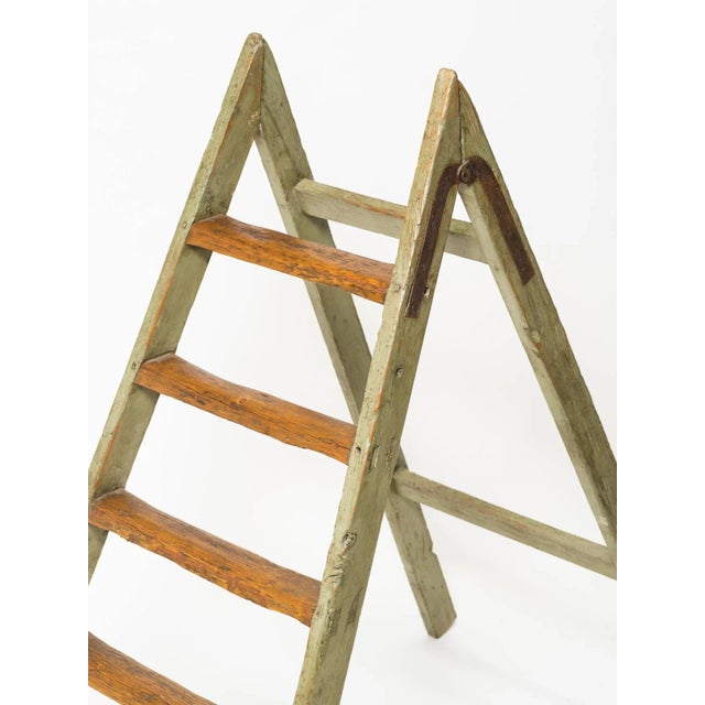 Nice decorative antique looking ladder. Washed green paint, worn look.