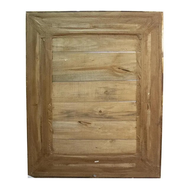 Handcrafted carved Regency Style wood mirror covered in gold foil.