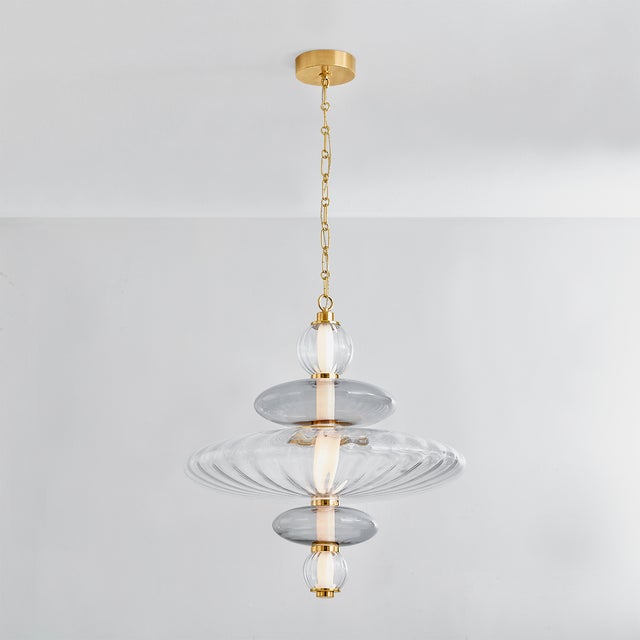 Old meets new in the nostalgic Williams pendant. Streamlined renditions of classic glass techniques are stacked to create...