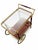 An elegant, sophisticated party trolley in the Hollywood Regency style, reminiscent of the iconic design language of...