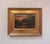 This oil on panel artwork captures a serene river scene bathed in warm autumn hues, reflecting the rich colors of the...