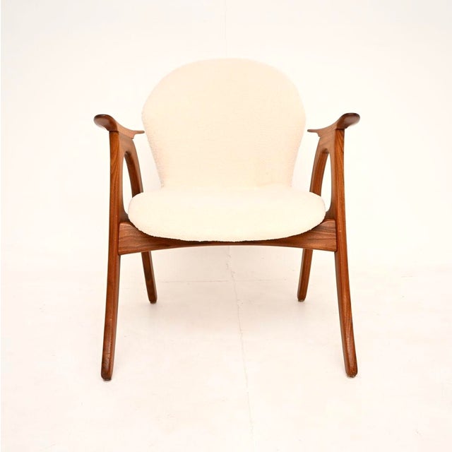 A stylish and very comfortable Danish vintage teak armchair by Aage Christiansen. This was made in Denmark by Erhardsen...