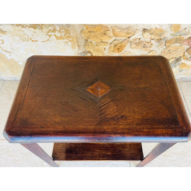 Art deco, vintage, two -tiered side table with shelf, 1930's. piece is made of walnut and a has a trapezoidal shape, (four...