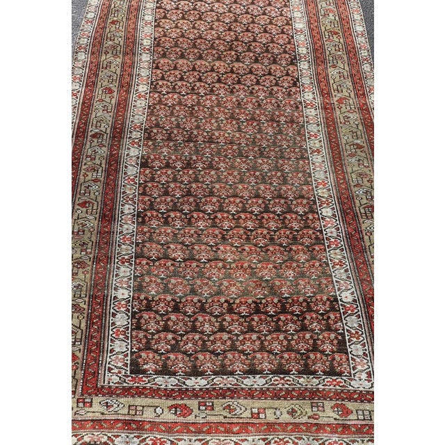 Tribal Antique Kurdish Gallery Runner With All-Over Paisley Design in Brown, Red, Green 4'3 X 10'1 For Sale - Image 3 of 10