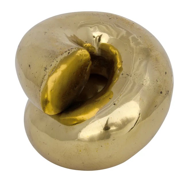 Organically intriguing, this tabletop sculpture has been hand-wrought of brass with a softly burnished finish.