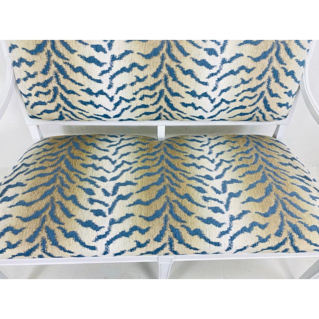 This is a French empire style Settee designed by Darryl Carter for milling Road by Baker. This settee has a white lacquer...