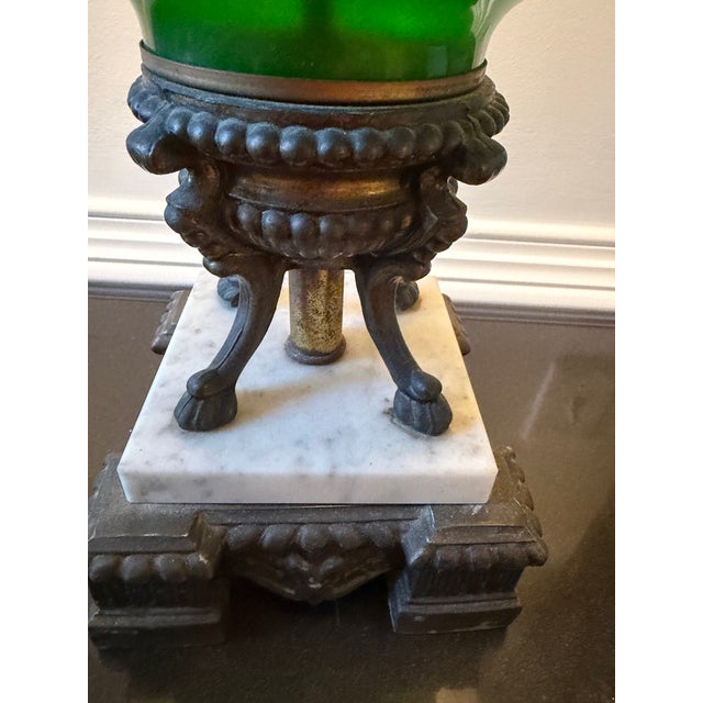 Body Material: Hand-blown, vibrant emerald-green art glass.Ornamentation: Intricate, raised gold overlay containing...