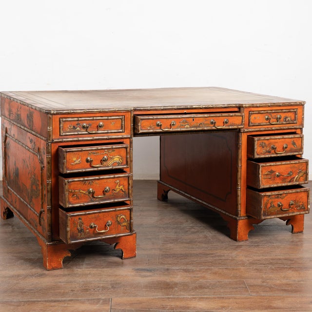 A Victorian faux bamboo Chinoiserie partners desk in re-laquered elm, the top with aged camel colored leather and gold...