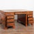 A Victorian faux bamboo Chinoiserie partners desk in re-laquered elm, the top with aged camel colored leather and gold...