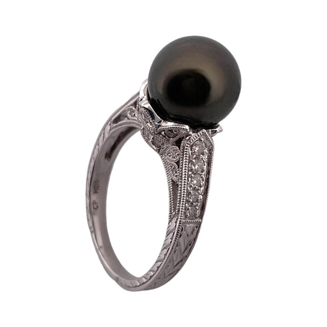 Elevate your style with this elegant 14K White Gold Grey Pearl and Diamond Ring. Featuring a lustrous grey pearl measuring...