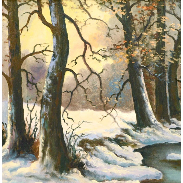 Peaceful winter landscape of a calm stream winding through a snowy forest by Lorenz Griffith (American, 1889-1968). Signed...