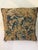 A striking decorative pillow featuring an antique early 18th-century needlepoint face, finished with a luxurious velvet...