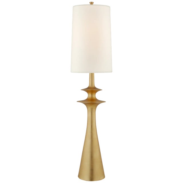 Lakmos Floor Lamp in Gild with Linen Shade Designer: AERIN Height: 58.25" Shade Detail: 12.5" x 14.5" x 22" Linen Base:...