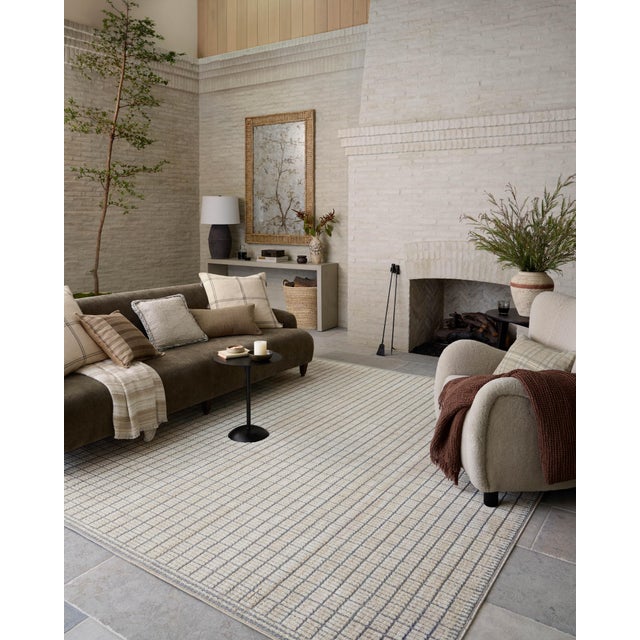 The Bexley Collection is a modern area rug with a loosely structured, organic design from Amber Lewis x Loloi. The rug...