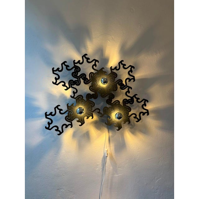 The extraordinary, sculptural wall lamp 'Paroq' was designed by Jenny Oldsjö and Ragnar Hultgren for the Belgian...
