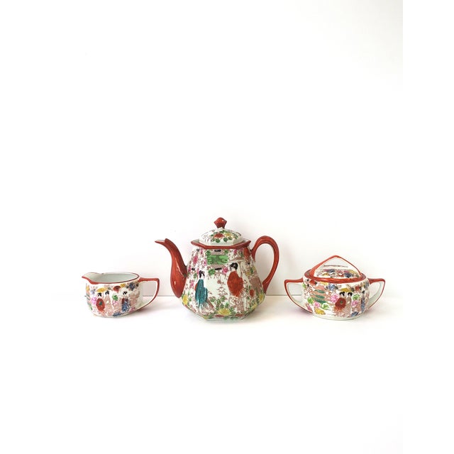 A Japanese hand‑painted porcelain tea or coffee set, in the Satsuma and Art Nouveau styles, circa mid‑20th century, Japan....