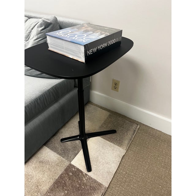 Authentic Davis Furniture Lift adjustable-height table in black. A sleek, contemporary designer piece featuring a rounded...