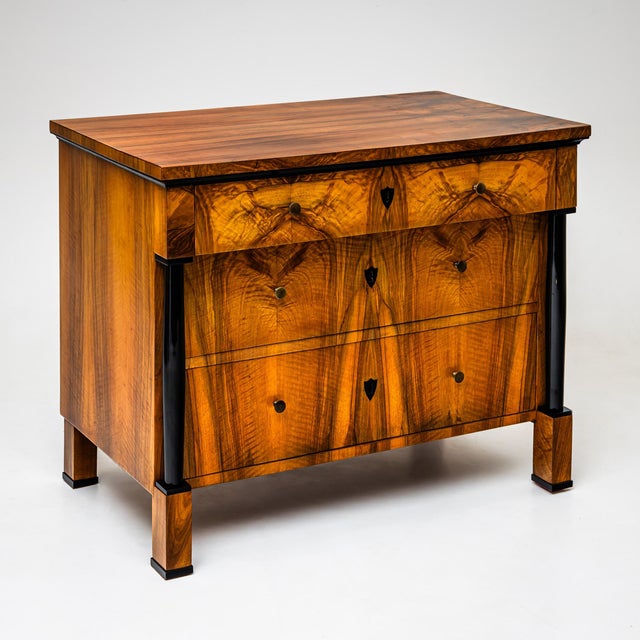 Three-drawer Franconian Biedermeier chest of drawers on plinthed square feet with ebonized full columns supporting the...