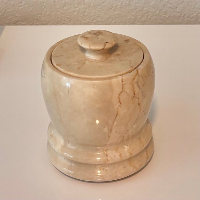 Italian Marble Jar with removable lid in a Latte Cream color with brown and ivory veining. Lovely piece. Material: Marble...
