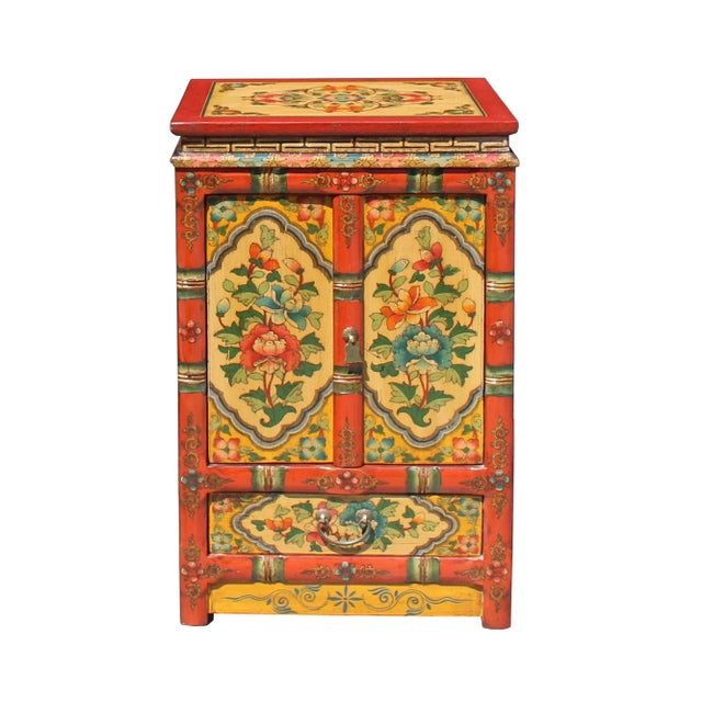 This cabinet / table is painted with colorful (orange rim and yellow base) Tibetan style flower graphic at the front, the...
