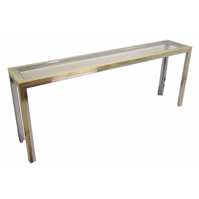 A table console, unique piece. Brass, chrome-plated steel, and crystal. It comes with an authenticity certificate from the...