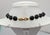 Circa 1986 goldtone black resin center with goldtone waves "puzzle" like front with round flat black resin beads with...