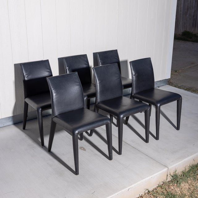 Set of six Vol Au Vent dining chairs, designed by Mario Bellini for B&B Italia in 2001 and made in Italy. The design is...