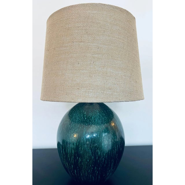 A beautiful large forest green French Art Deco ceramic lamp by Primavera. Rewired with aged brass double sockets and silk...