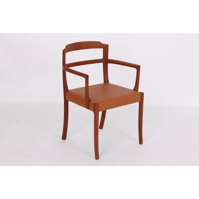 Beautiful mahogany armchair designed by Ole Wanscher for the furniture manufacturer A. J. Iversen. The armchair is in...