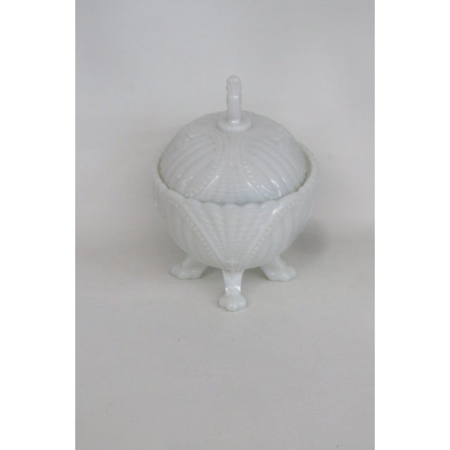 This lovely lidded Candy Dish is made out of white milk glass with an embossed rib and scroll pattern. This Candy Dish...